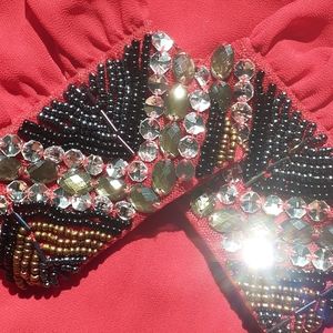 Mesmerizing red Dina Be dress with beaded cuffs